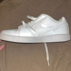 White and black Nike shoes